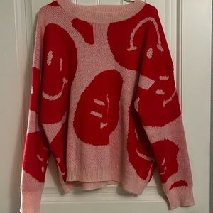 Pink smiley faces over sized alter’d state sweater